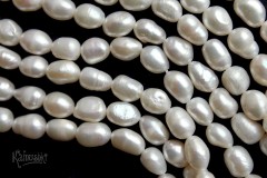 Жемчуг белый, барочный 7х9 мм, набор 9 бусин Жемчуг белый, барочный 7х9 мм, набор 9 бусин